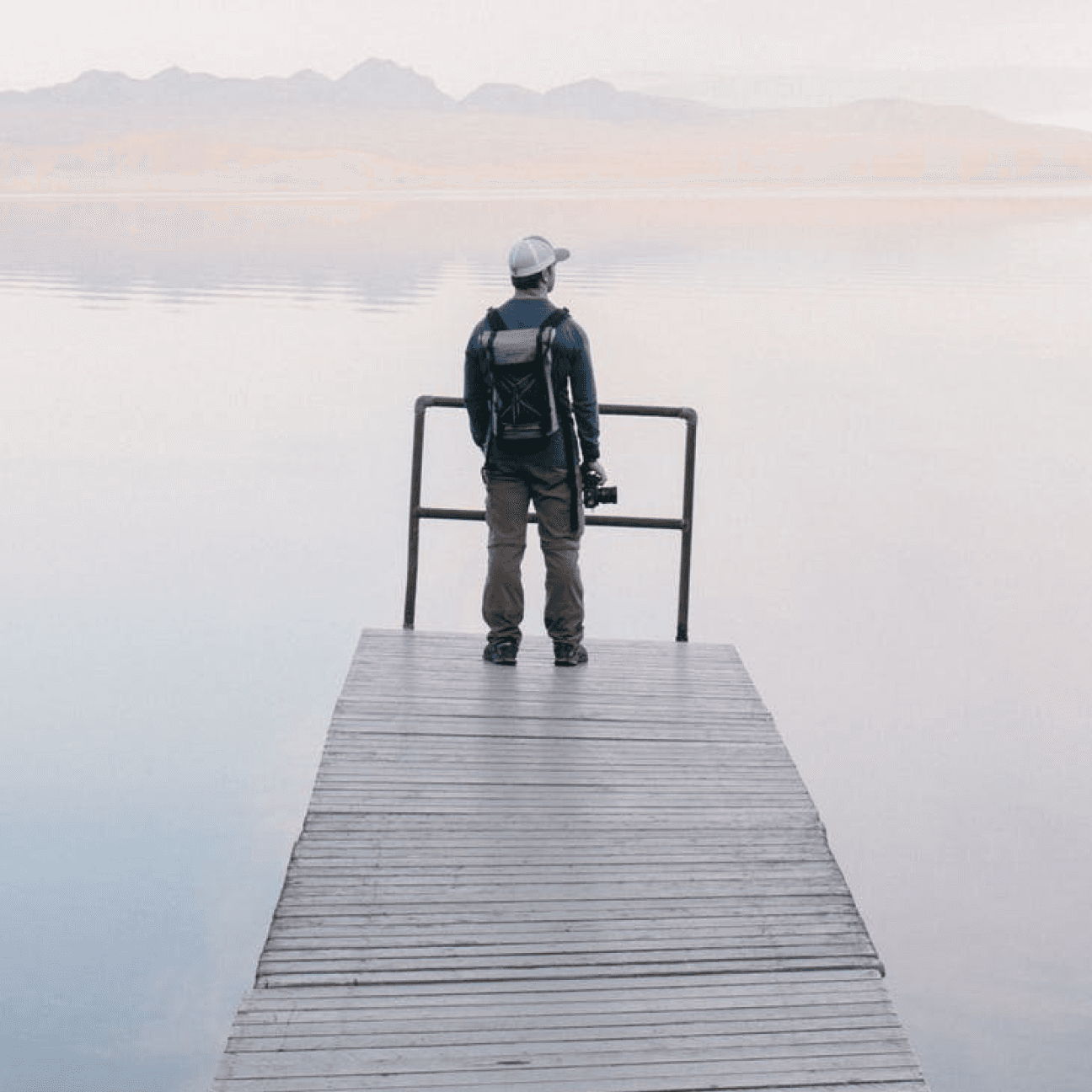 Man overlooking lake